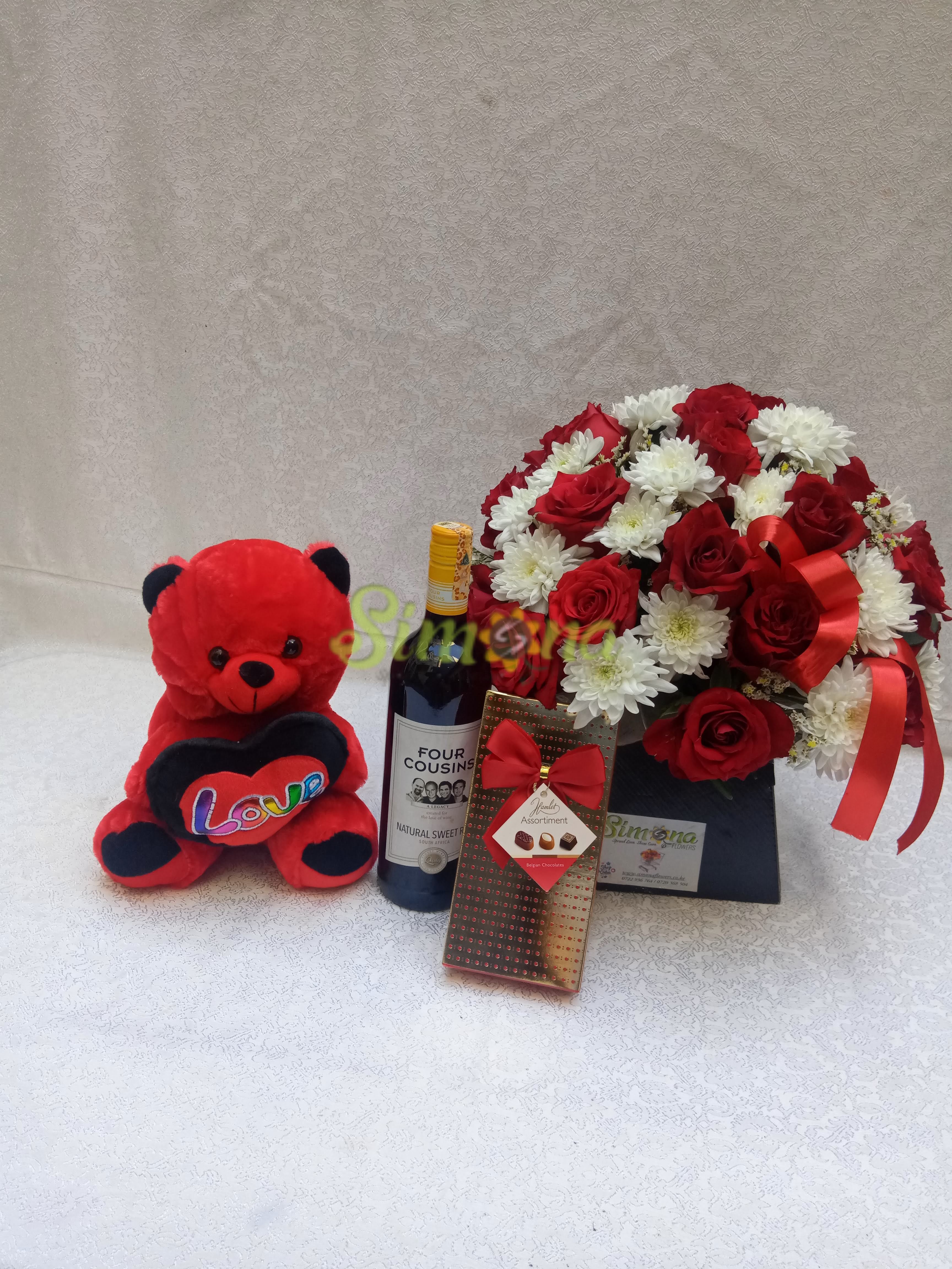 Adorable bouquet with dotted box hamlet chocolate, teddy bear and red wine