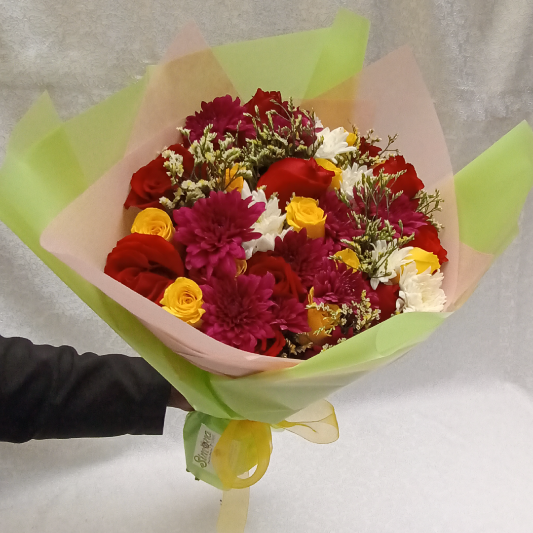Simona Flowers Kenya - Assorted Sprinkles Bouquet is A sweet mix of colors in this wonderful assortment of flowers inclusive of: Red Roses White Chrysanthemums Lavender Chrysanthemums Yellow Roses and Seasonal Flower Fillers