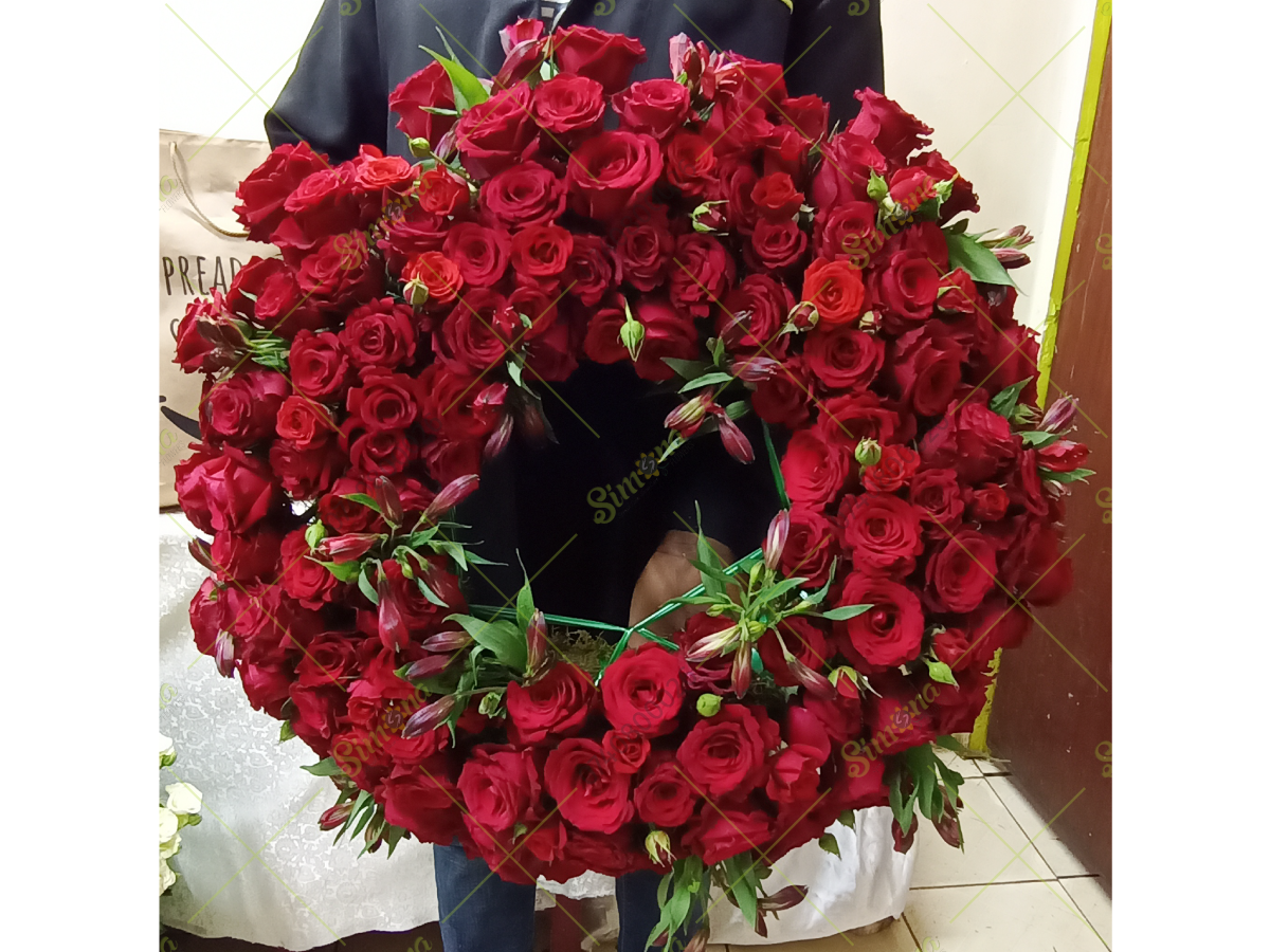 Corporate red round funeral wreath