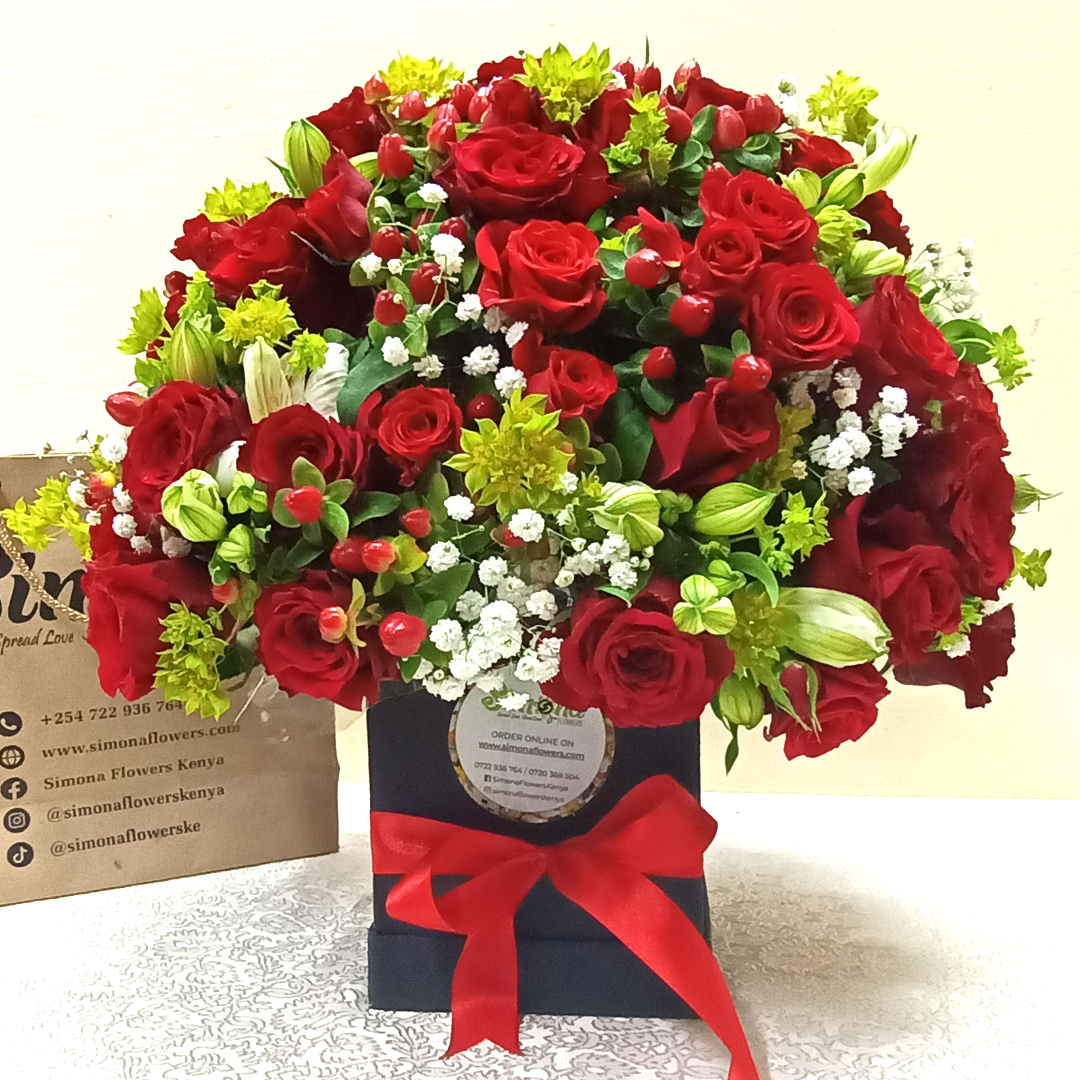 Simona Flowers Kenya - Designer flowers are made for class. The Scarlet Royal Dome Bouquet wishes a lover a lovely happy birthday even without the words. It is arranged with : Red Roses Hypericum Flowers Baby Breathe Flowers Alstromeria Flowers & Tropical Flower Fillers