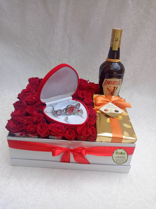 Simona Flowers Gifts - The Valentino chain set package is a sweet surprise package for your valentine. With a creamy Amarula, arranged flowers, a box of sweet chocolates and the remarkable chain set, you can be sure that it will be all smiles when they receive the romantic package.