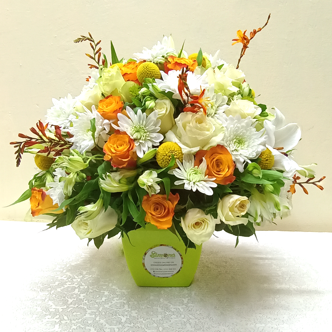 The Thrilling Bouquet by Simona Flowers Kenya, is a classy royal box flower arrangement design. It is prepared with roses and chrysanthemums and is blended with various flower fillers. It can be presented as a birthday, romantic or anniversary gift, to tell someone I love you or even to celebrate someone's graduation.