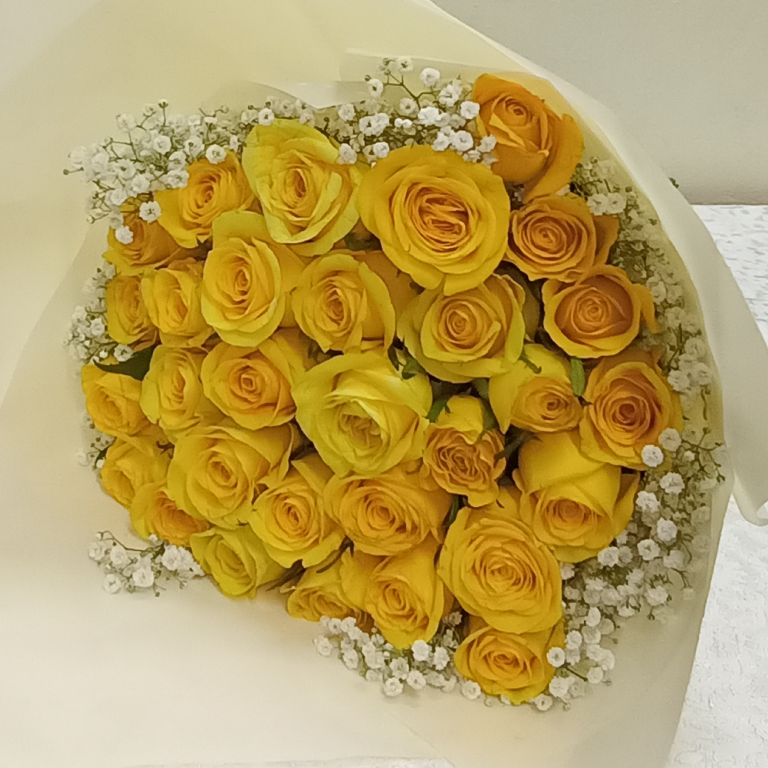 Yellow Roses Blend Bouquet by Simona Flowers Kenya,is a monochromatic blend of roses ranging from pink to red to orange to yellow to lavender and white roses, with a finishing of white fillers wrapped with care to present with love to the special someone in your life.