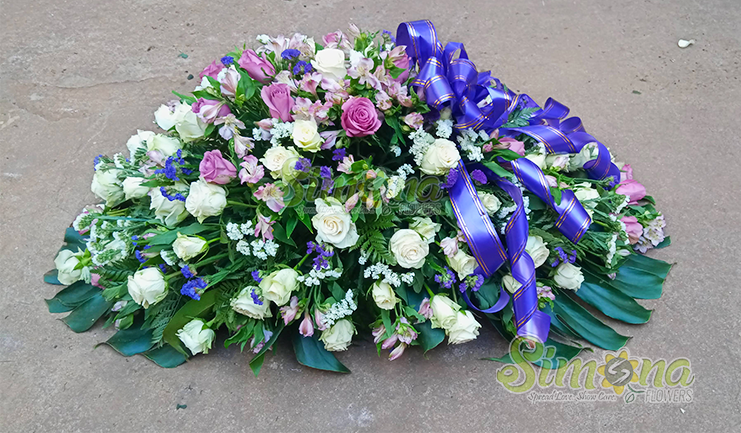 Comfort casket flower arrangement by Simona Flowers