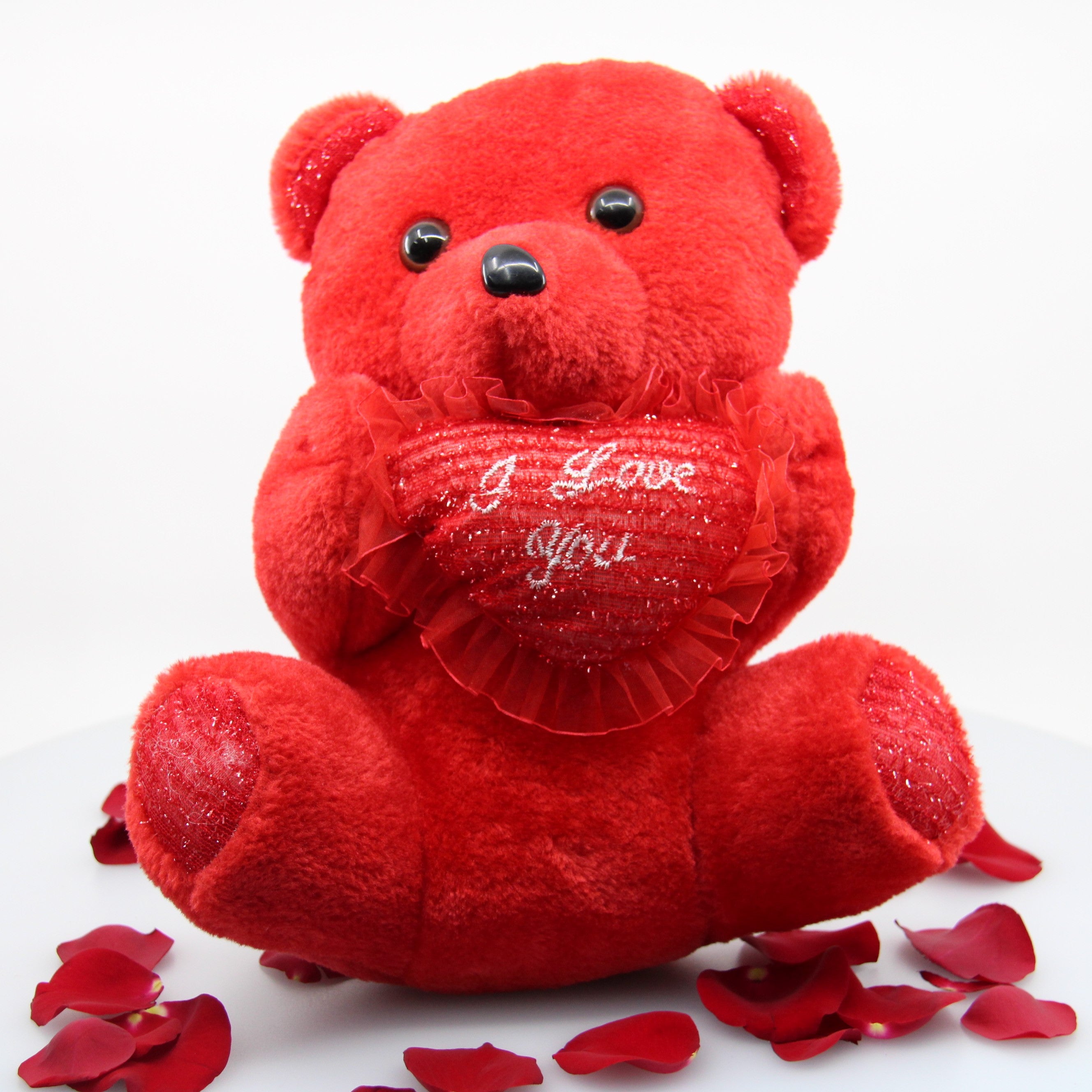 Simona Flowers - Spread some love this year with the red valentine teddy bear that holds a love heart saying I love you.