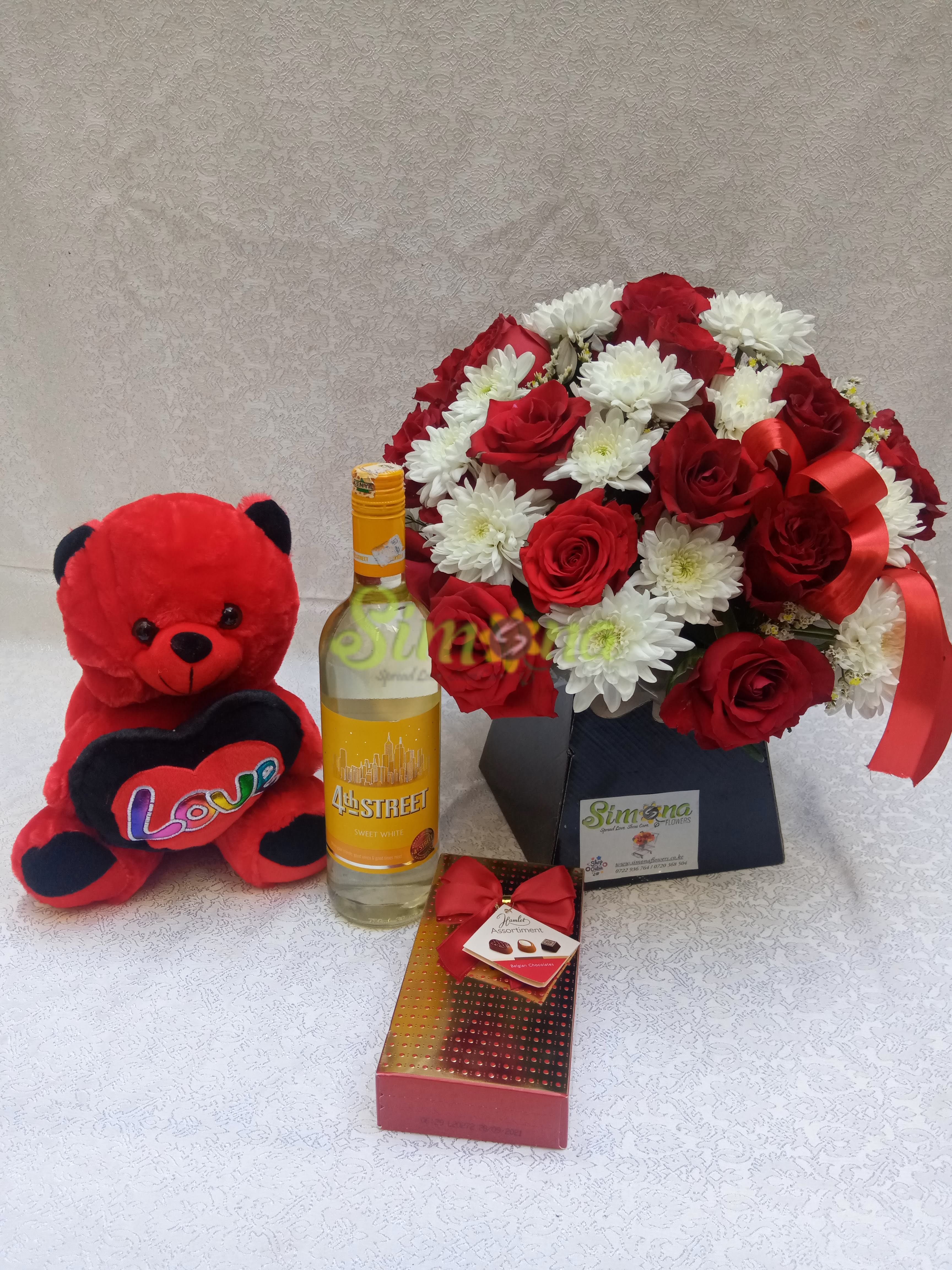 Adorable bouquet with dotted box hamlet chocolate, teddy bear and red wine