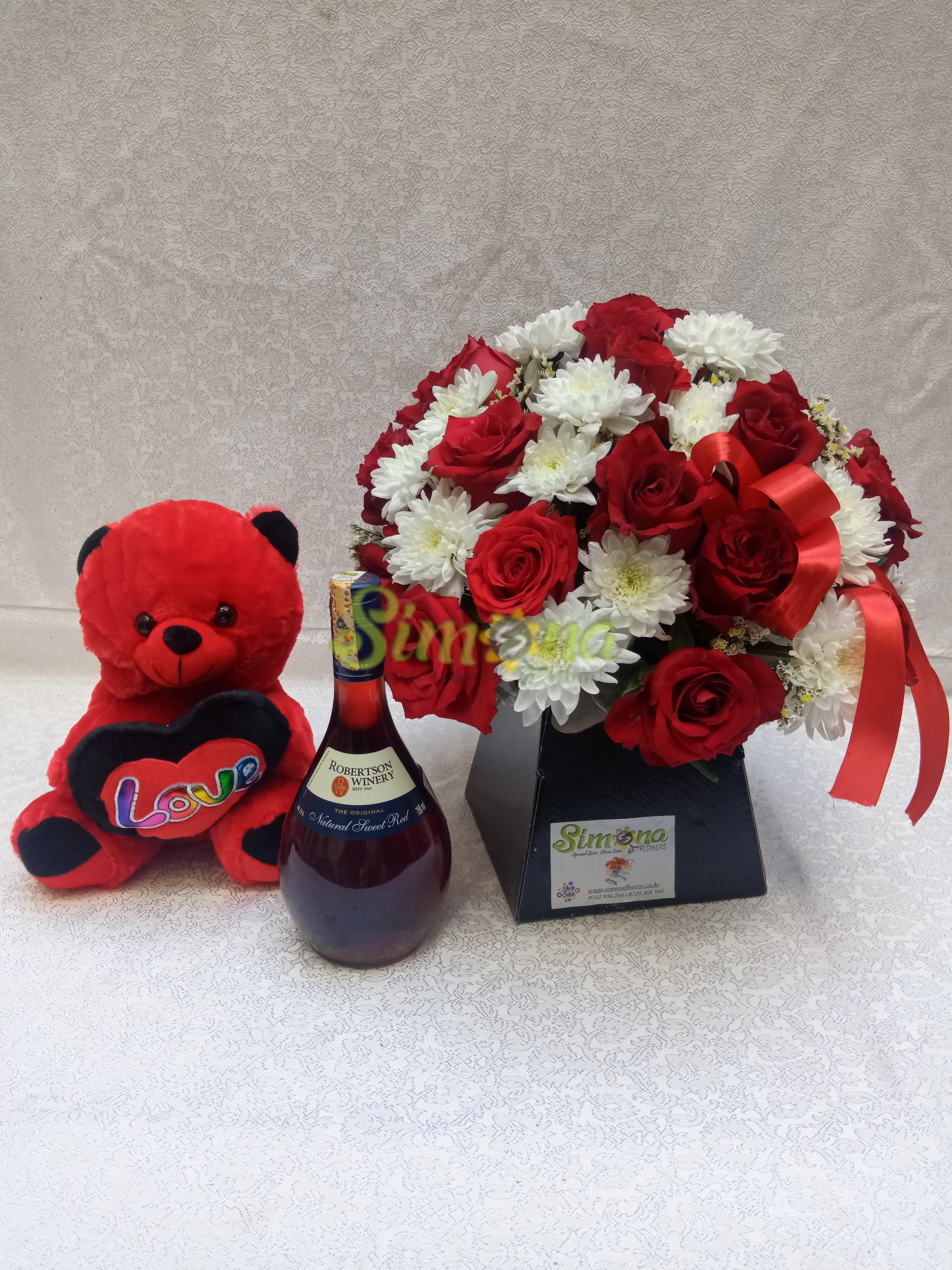Adorable bouquet with teddy bear and red wine