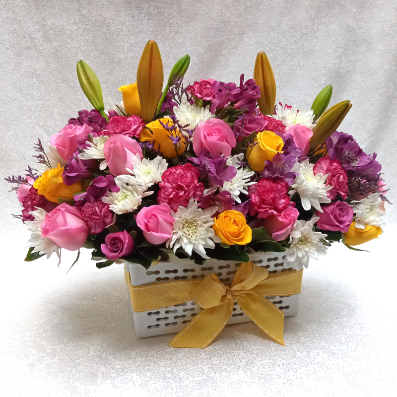 The Amazing Friendship Bouquet by Simona Flowers Kenya, contains Beautiful flowers arranged in a royal box and prepared with:  Pink Roses Yellow Roses Alstromeria Flowers Lilies Flowers White chrysanthemums & Carnations