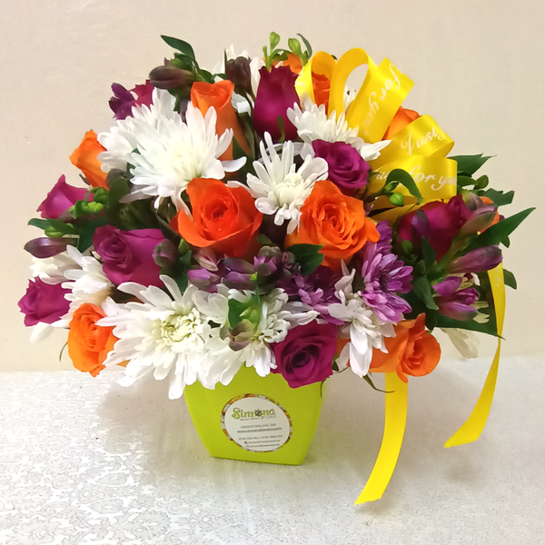 Simona Flowers Kenya - Spread Love with this gorgeous white Birthday Bundle Bouquet, sure to brighten up their special day. With assortment of;  Lilac Roses, Orange Roses White Chrysanthemums Lavender Chrysanthemums Astromeria and Seasonal Foliage Fillers