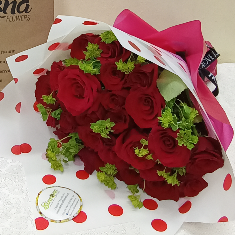 The Bunch of Beauties bouquet by Simona Flowers Kenya, is a perfectly hand-tied floral arrangement with red roses and blended with flower fillers to give a wonderful look. It is wrapped to fit the occasion, whether it's a birthday, anniversary and will definitely bring a smile to the recipient.