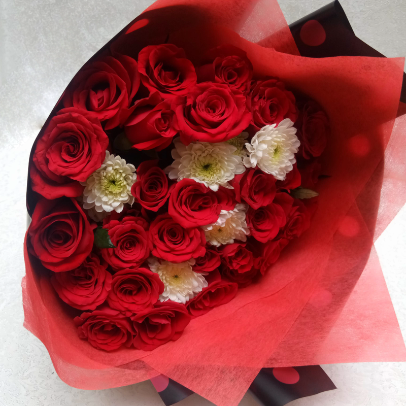 The Bunch of Beauties bouquet by Simona Flowers Kenya, is a perfectly hand-tied floral arrangement with red roses and blended with flower fillers to give a wonderful look. It is wrapped to fit the occasion, whether it's a birthday, anniversary and will definitely bring a smile to the recipient.