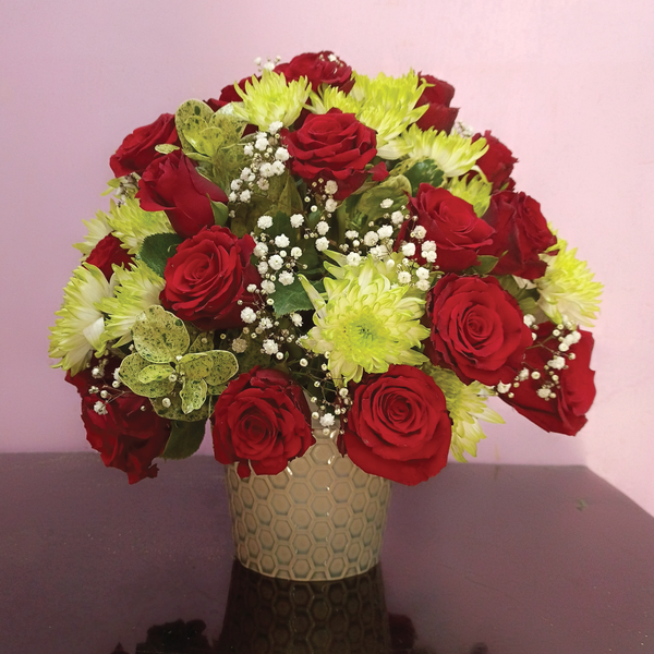 The Classic Freshness Vase Flowers Arrangement by Simona Flowers Kenya. Consisting of Red Roses, green chrysanthemum flowers, baby breathe and fresh green foliage in a classic ceramic vase.