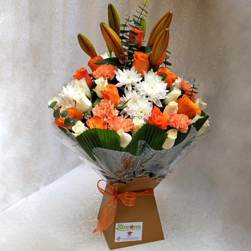 Simona Flowers Kenya - The Delightful Royal Bouquet contains Beautiful flowers arranged in a royal box and prepared with:  Orange Roses White Roses Lilies Flowers White chrysanthemums Carnations & Seasonal Flower Fillers