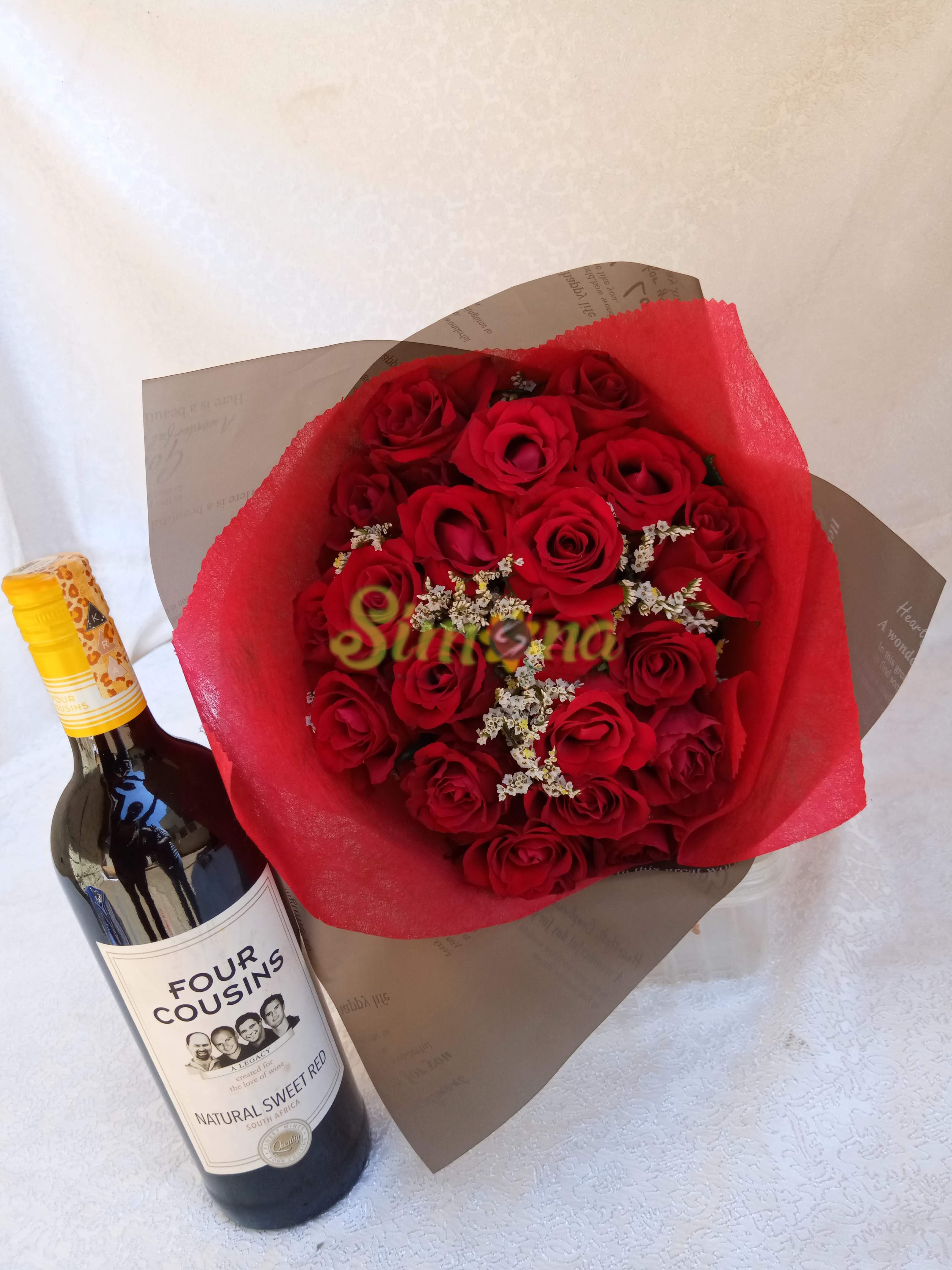 Delightful hand bouquet with red wine