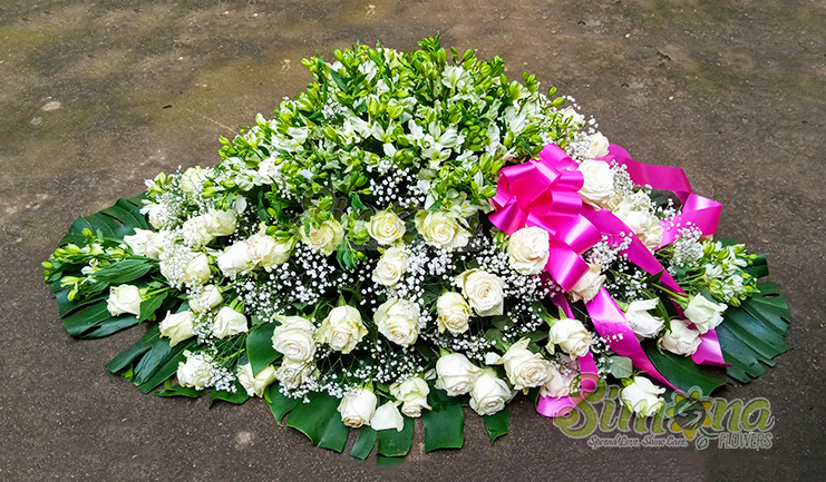 Faithful wishes coffin spread flower arrangement by Simona Flowers