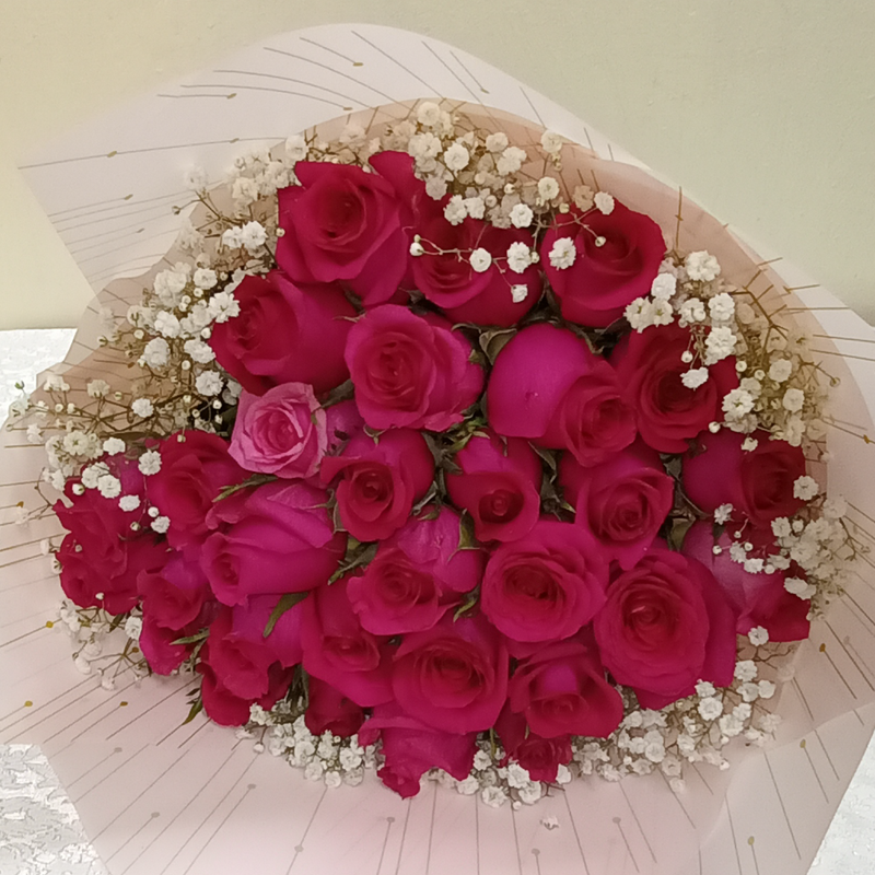 Pink Roses Blend Bouquet by Simona Flowers Kenya,is a monochromatic blend of roses ranging from pink to red to orange to yellow to lavender and white roses, with a finishing of white fillers wrapped with care to present with love to the special someone in your life.