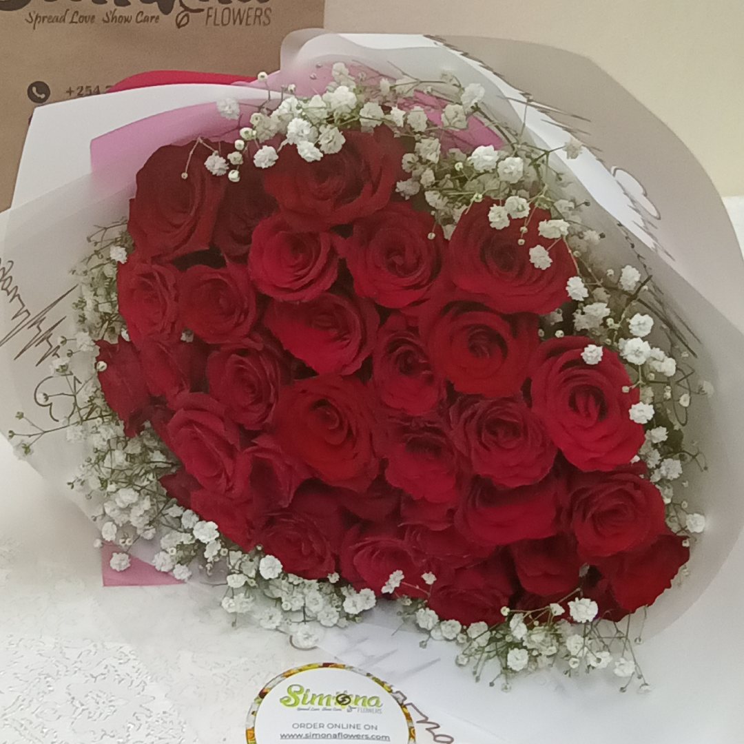 Red Roses Blend Bouquet by Simona Flowers Kenya,is a monochromatic blend of roses ranging from pink to red to orange to yellow to lavender and white roses, with a finishing of white fillers wrapped with care to present with love to the special someone in your life.