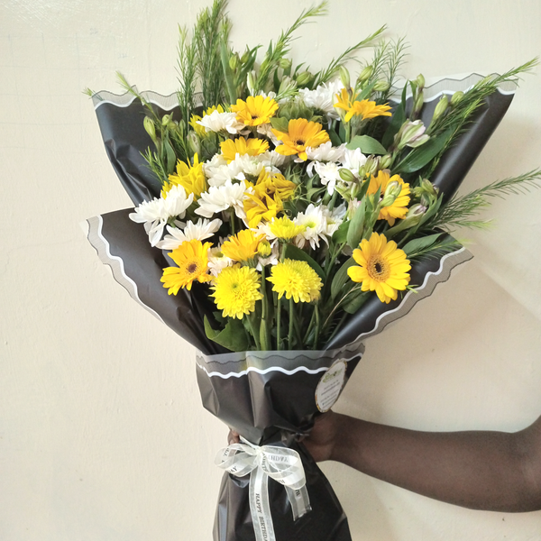 Simply The Best Bouquet by Simona Flowers Kenya, includes a beautiful assortment of white and yellow chrysanthemums flowers. It can be used to say I'm thinking about you, You are a gem, You are special, I am grateful for your presence in my life.