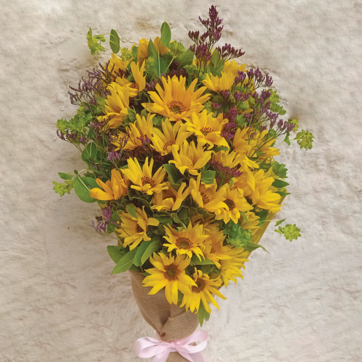 Sunflower Bouquet by Simona Flowers Kenya - Get the awesome sunflower bouquet and brighten up someone's day. It is brightly themed for a happy mood and wrapped with material for a classy finish. Have it delivered at home, work or even in the hospital on the same day.