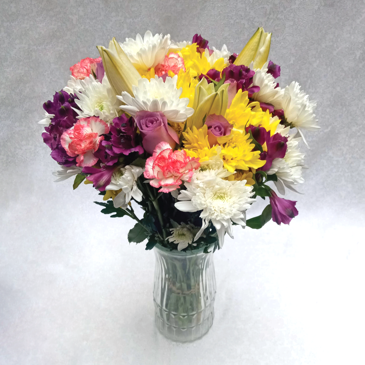 The Velvets Touch Vase Flower arrangement by Simona Flowers Kenya. Consists of a variety of tropical flowers special to surprise a loved one, who has a love for purple, with; to let them know they are of great value in your life.