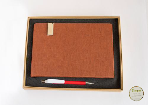 Simona Flowers Gifts - A simple yet awesome pack of a brown notebook and classic pen as a gift to someone on their special day.