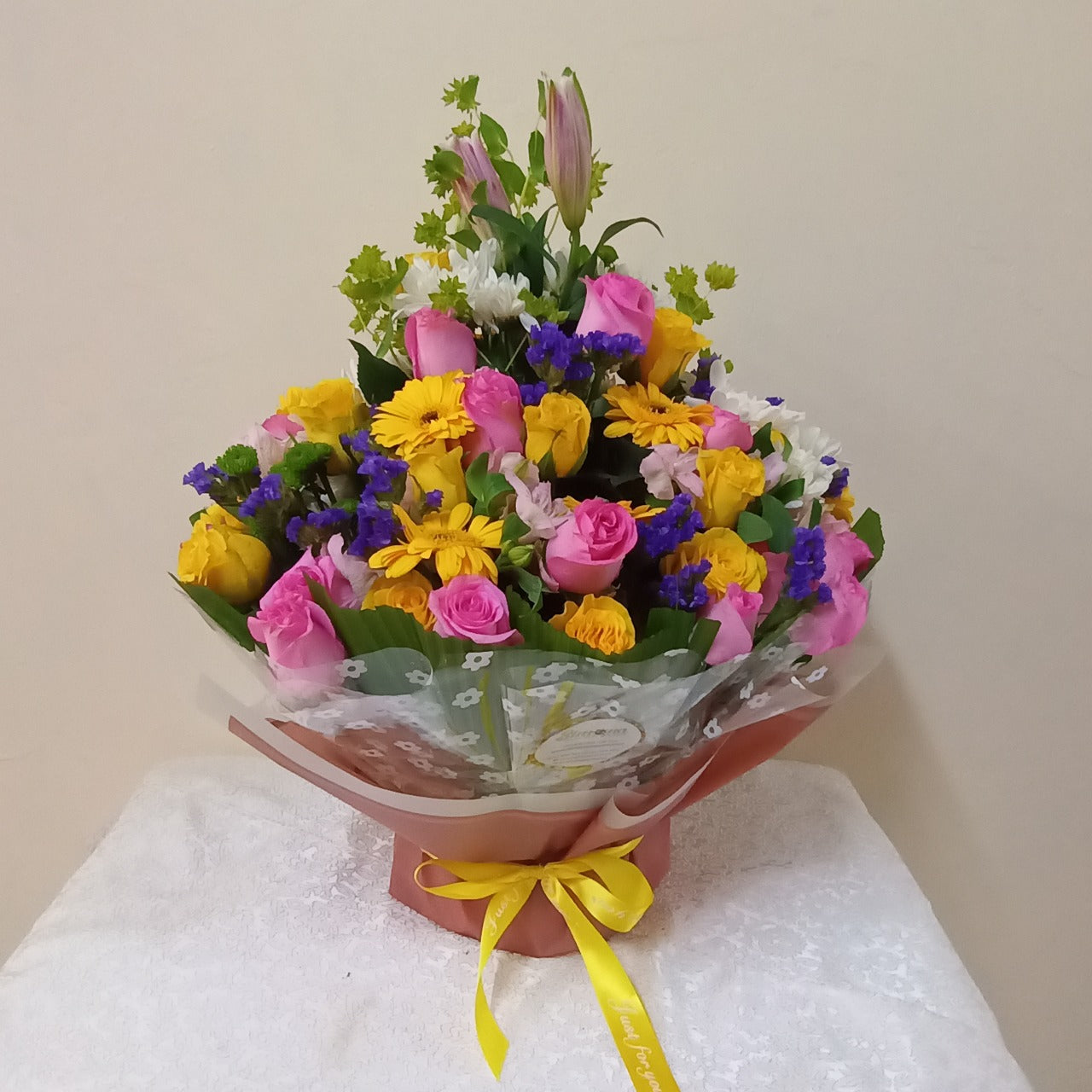 Simona Flowers - This bouquet is nice when wishing someone congrats on any success that they may have accomplished. The bouquet is well arranged with fresh roses and mums and complimented with other flower fillers to make all the colors pop!