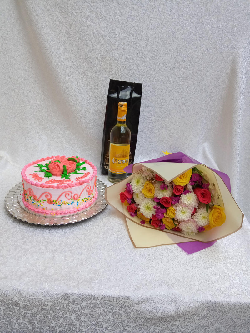 Assorted magenta hand bouquet of flowers, orange cake and white fourth street wine