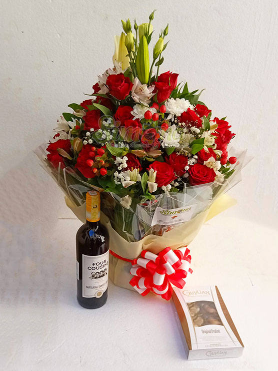 Red themed water bouquet with Four cousins red wine and Belgian Guylian chocolates by Simona Flowers