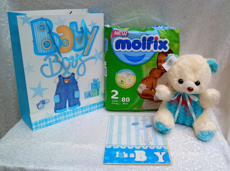 So sweet new baby package of diapers and teddy bear and card by Simona Flowers