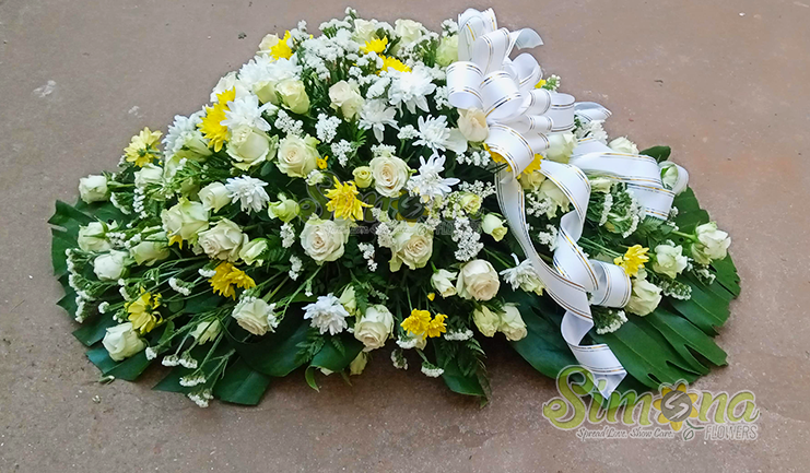 Warm embrace casket spread flowers by Simona Flowers